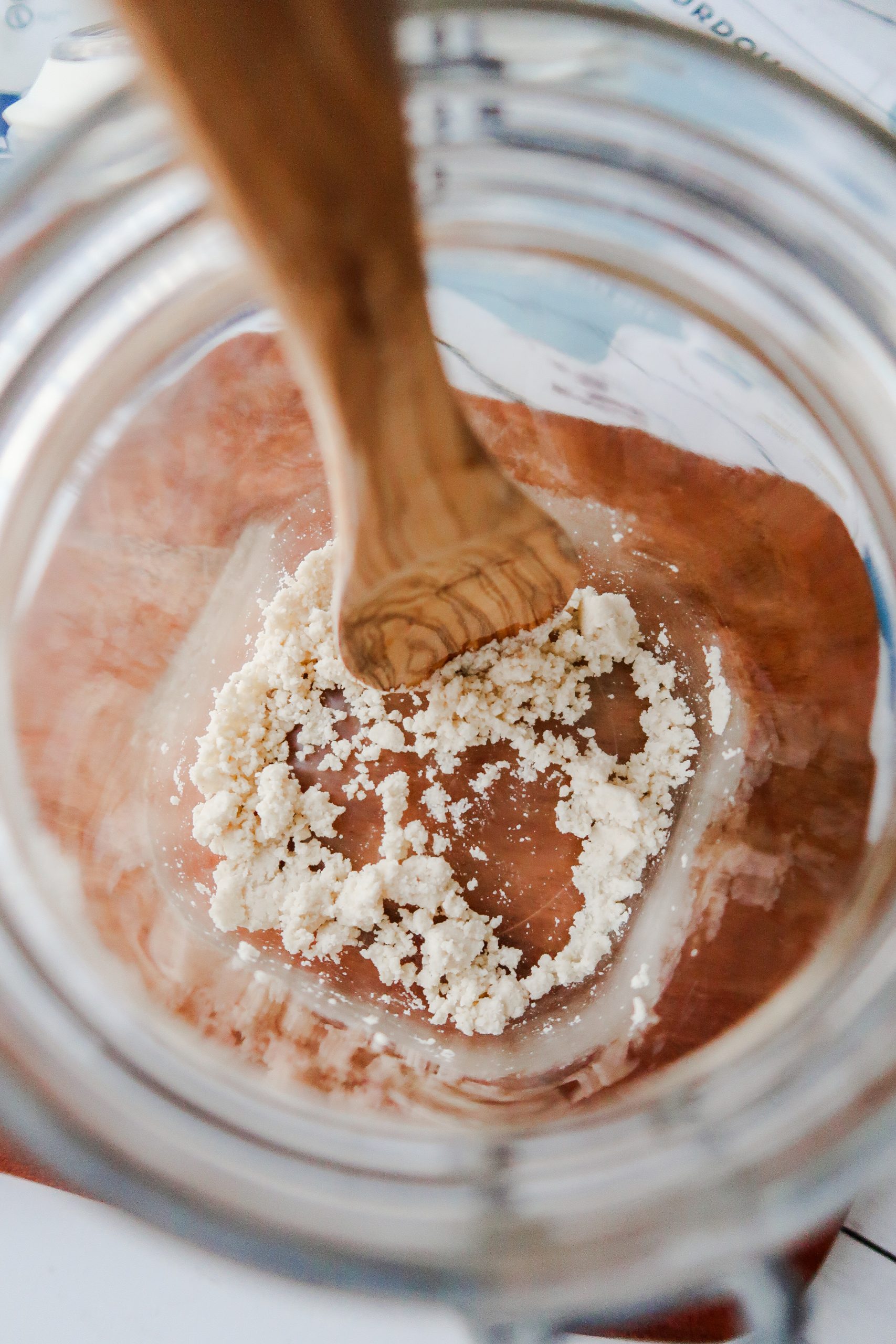Stirring the gluten free sourdough starter mixture in the jar. Wonders of Cooking